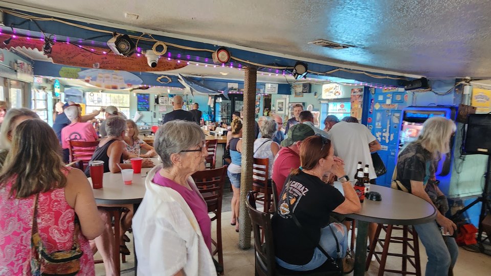 Casual bar seating inside Fisherman's Shack.